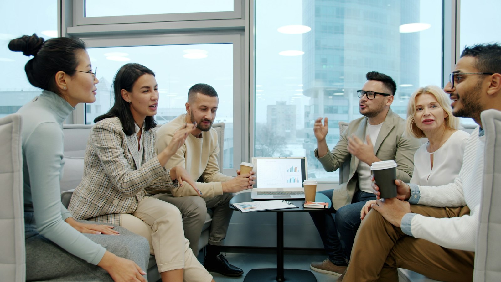 Technology professionals in a team discussion in a modern office